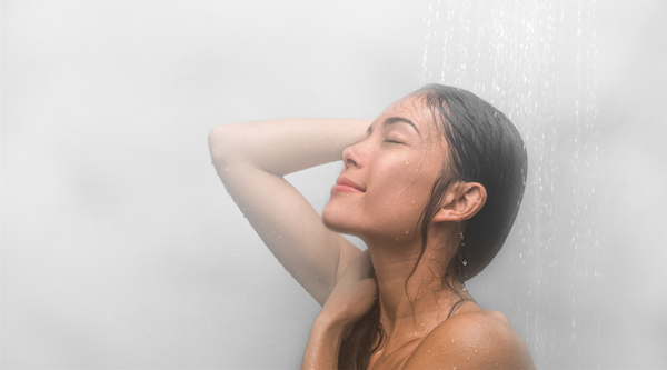 Asian woman taking a hot steaming shower